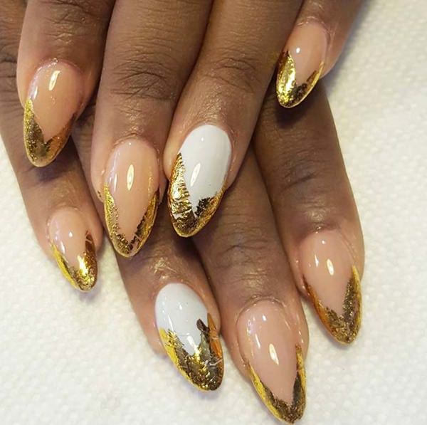 Golden tips on acrylic nails